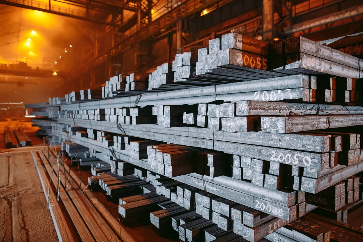 Steel bars stored in a warehouse, showing the as-supplied surface condition
