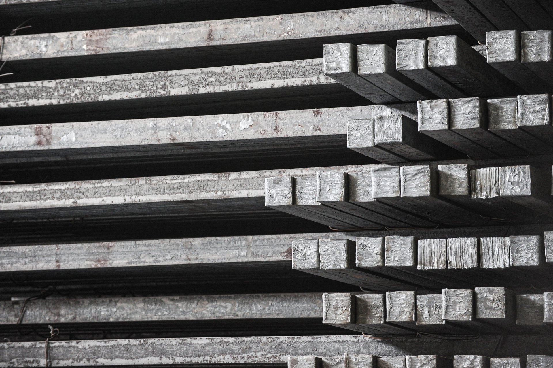 Steel billets stacked in a metallurgical factory warehouse