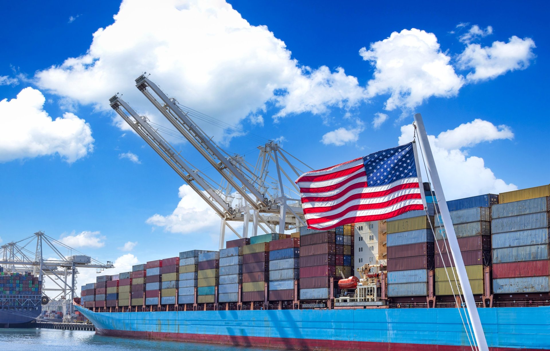 Container cargo and freight ships docked at a port terminal