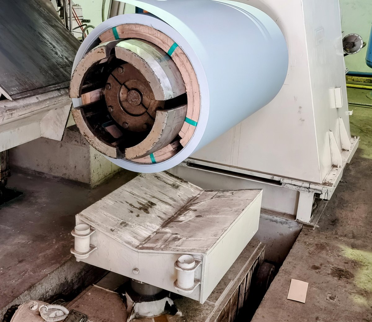 Industrial steel processing machinery being installed on a production line