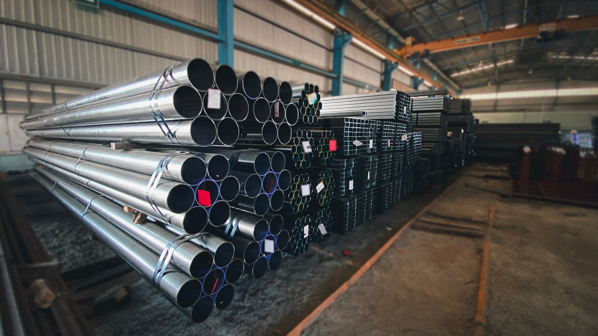 Hollow Sections Exporter fabrication context — cold-formed structural square hollow section staged in warehouse for specification verification