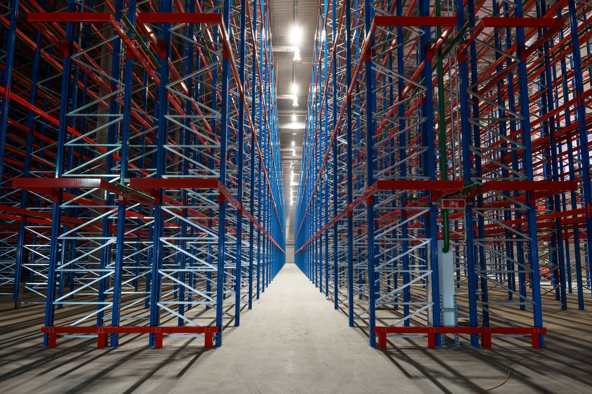 Tall racking holding long steel product in a distribution warehouse