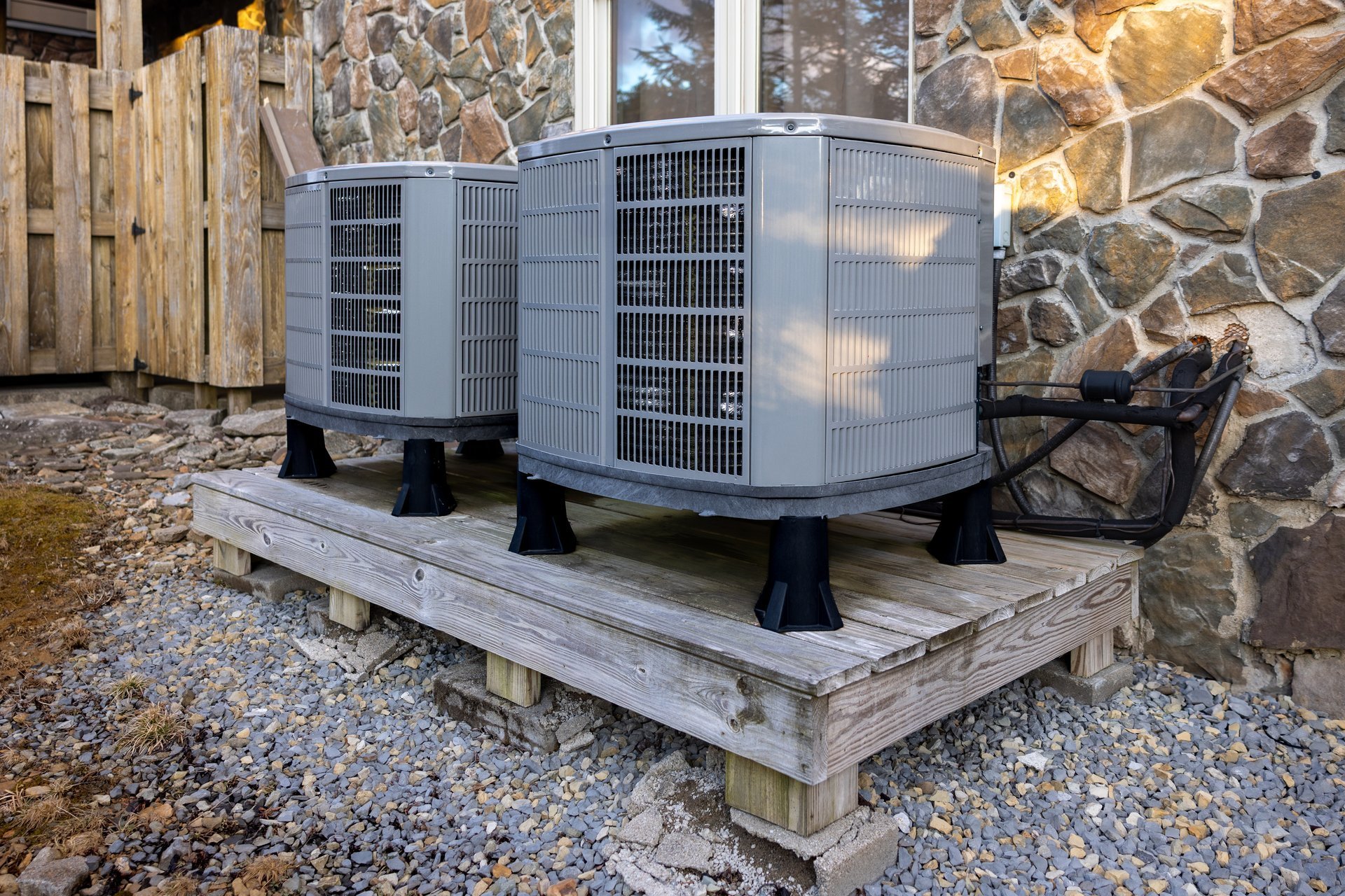Outdoor air conditioning condenser units installed beside a building