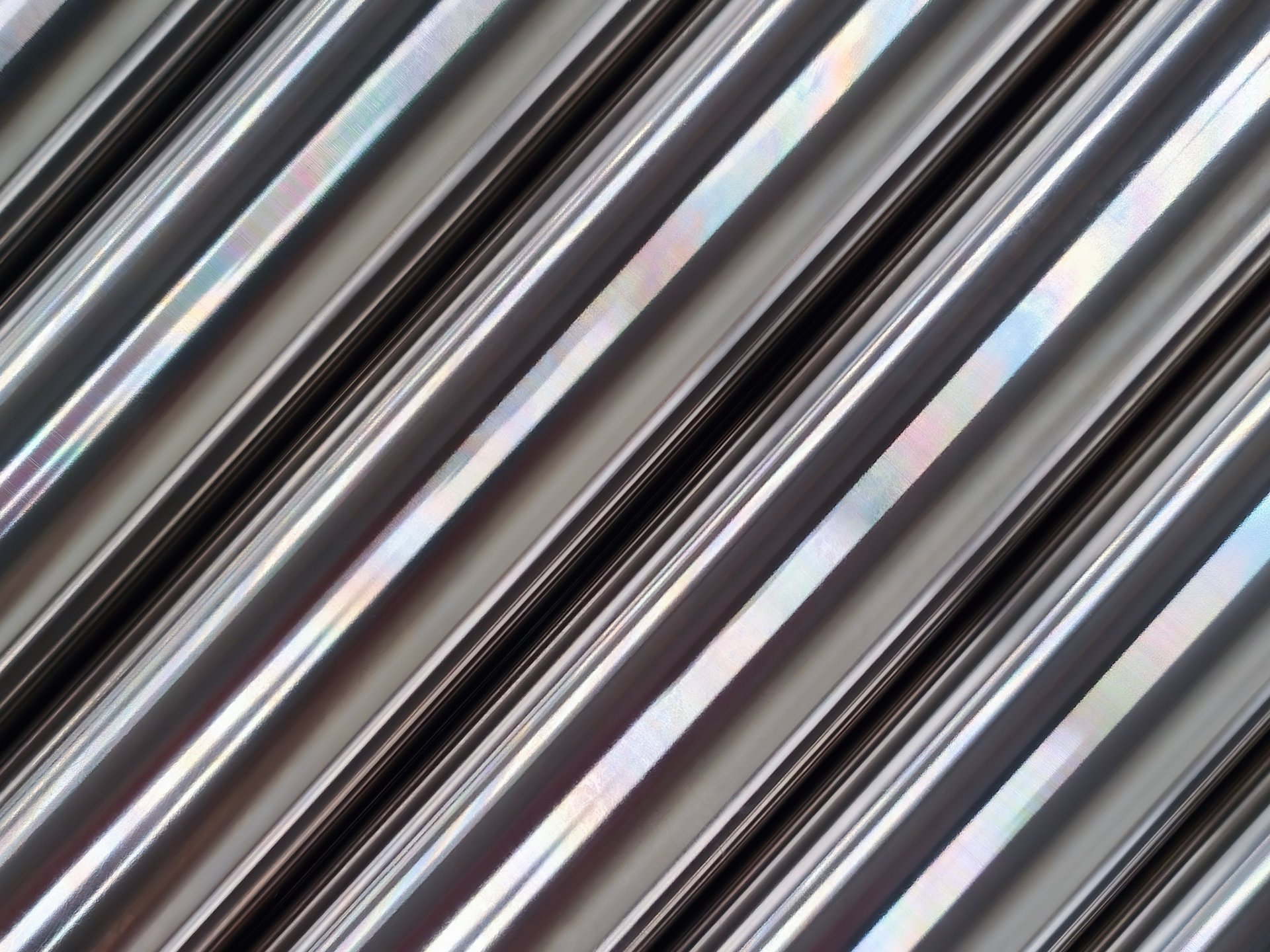 Bright polished stainless steel pipes in an industrial setting for commercial and logistics planning