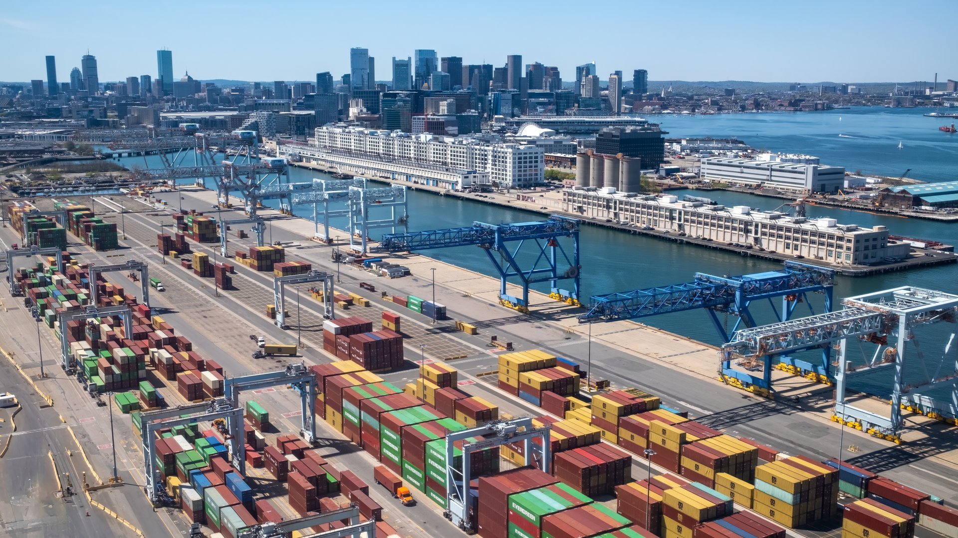 Container terminal with vessels and handling equipment at a commercial port