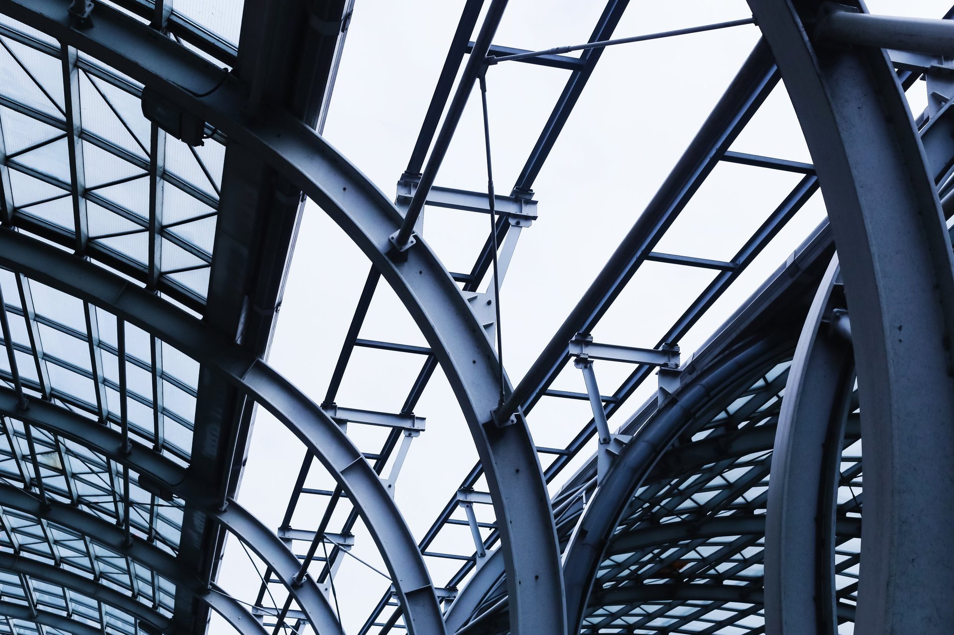 Exposed steel building framework in service against an open sky