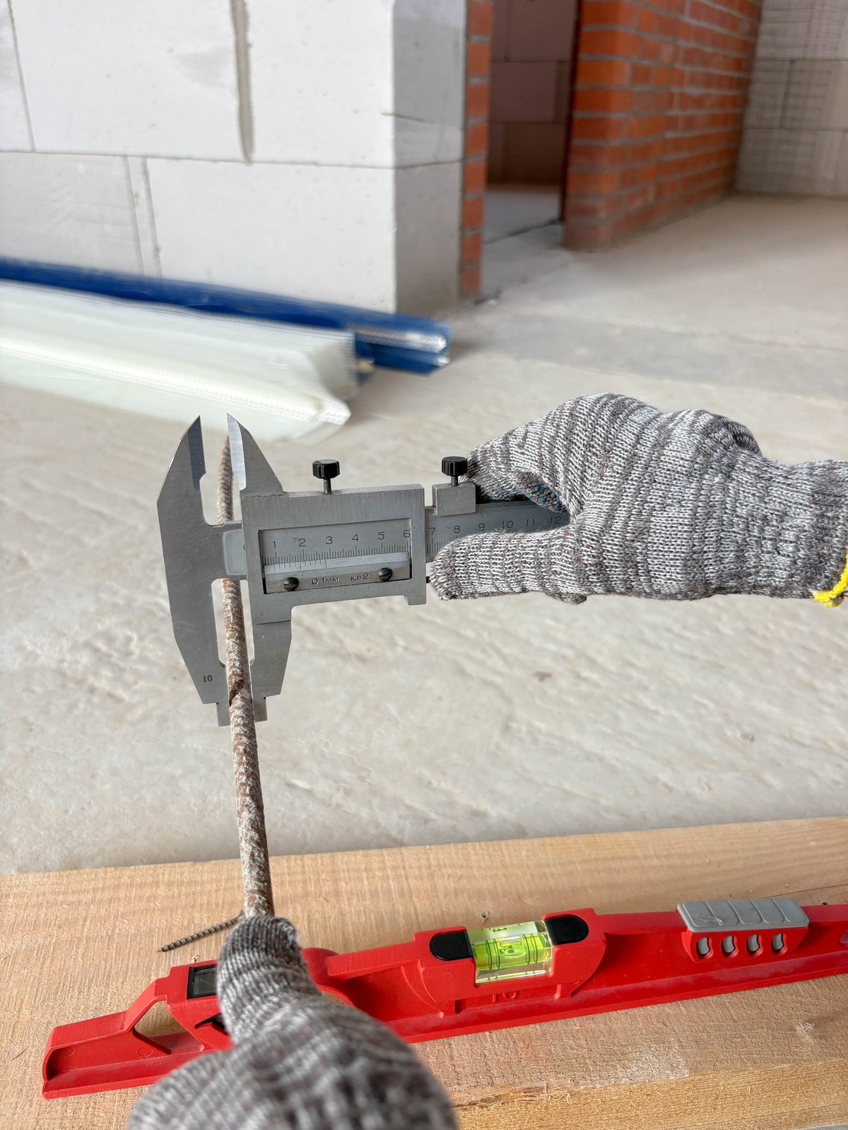 Deformed reinforcement bars being checked for size and bundle identification.