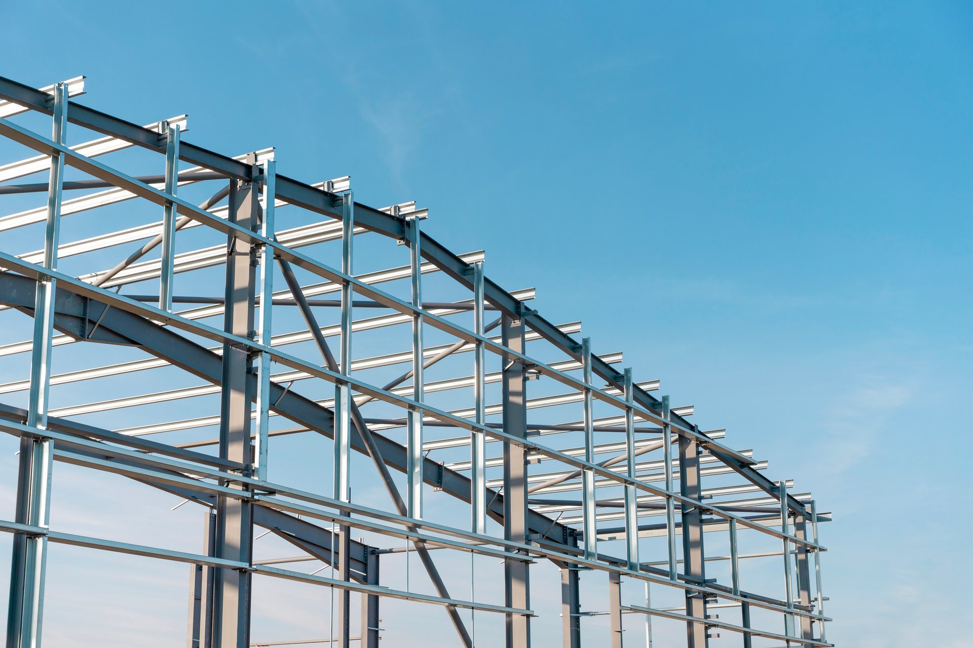 Construction of a new industrial building warehouse with a structural steel frame made of hollow sections