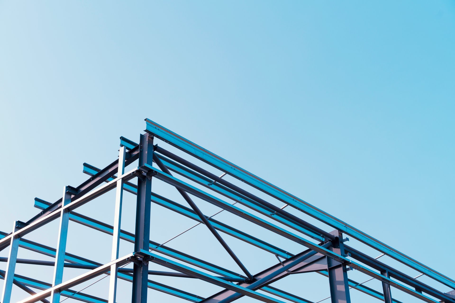 Steel-frame construction of an industrial building using structural carbon steel beams and columns