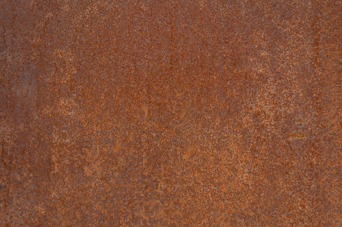 Close-up of corroded steel surface showing the effect of an unresolved exposure mechanism