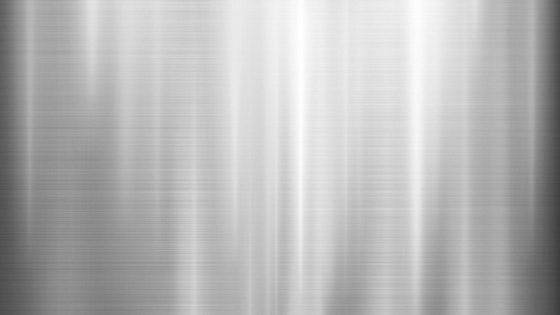 Brushed metal surface with fine vertical reflections showing a smooth finish