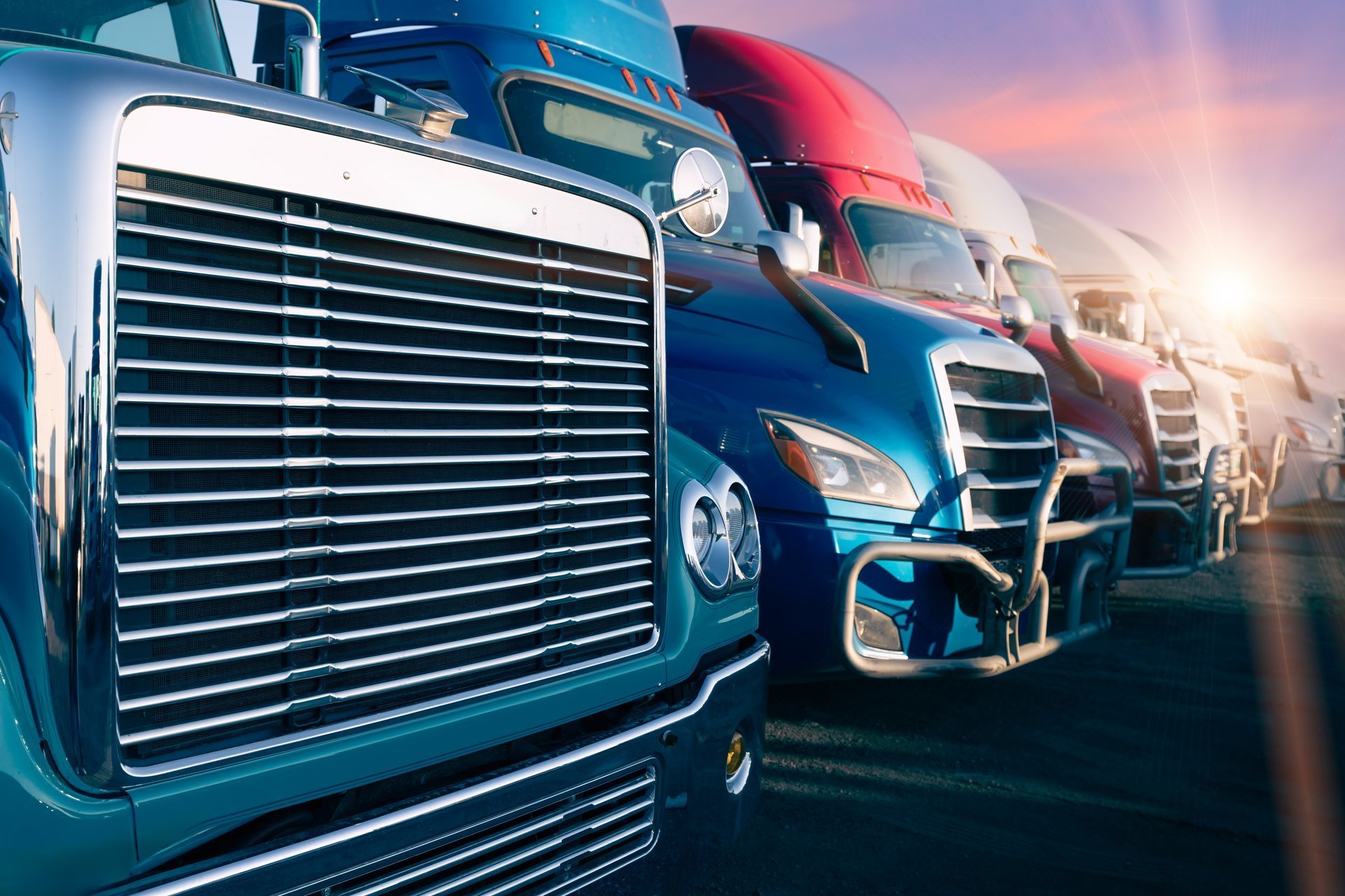 Container trucks carrying commercial cargo staged for onward delivery