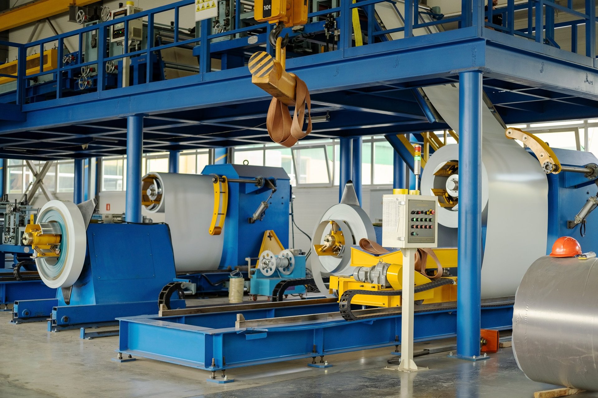 Coated steel coil on a decoiler feeding a processing line