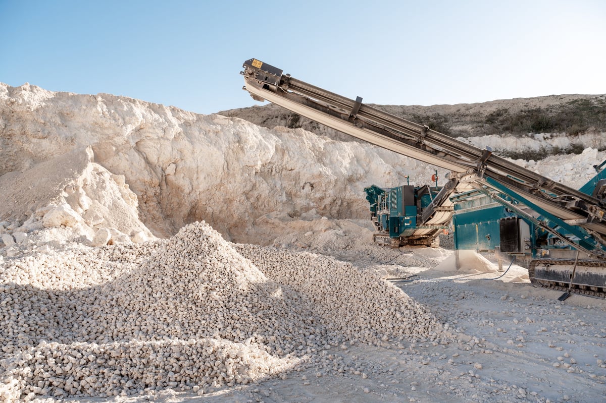 Inspection setup for checking 65% Fe Iron Ore sample, size and quality documentation.
