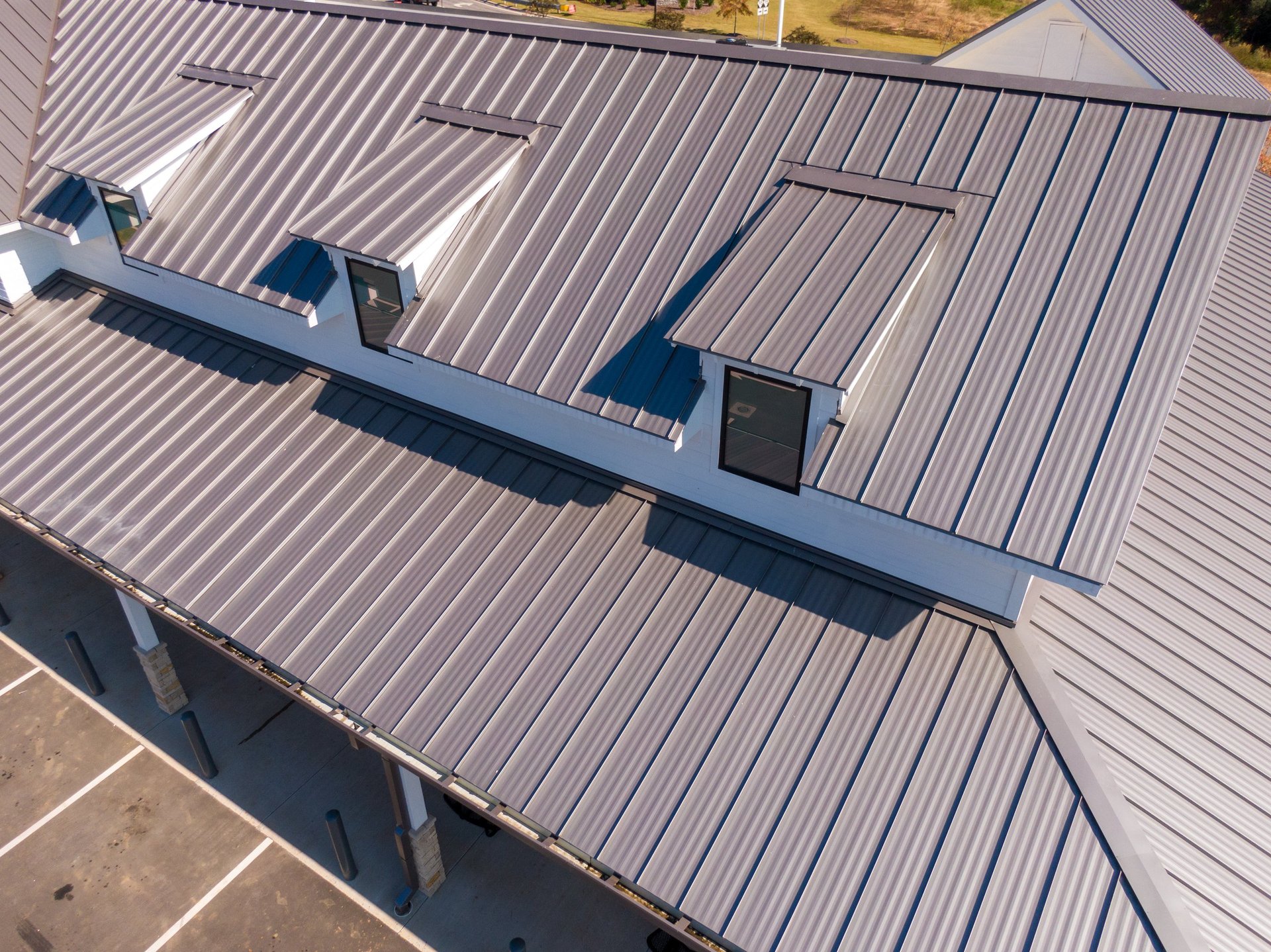 Aerial view of industrial buildings with standing seam metal roofs and a profiled wall envelope