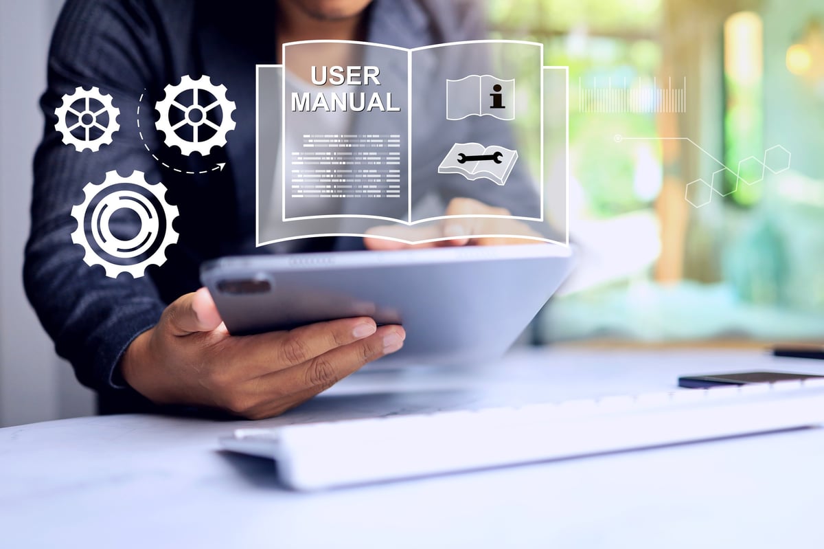 Engineering reference document open beside a sheet specification under review