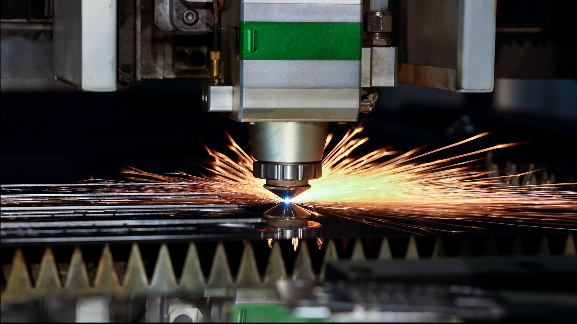 CNC machine cutting metal components during industrial fabrication