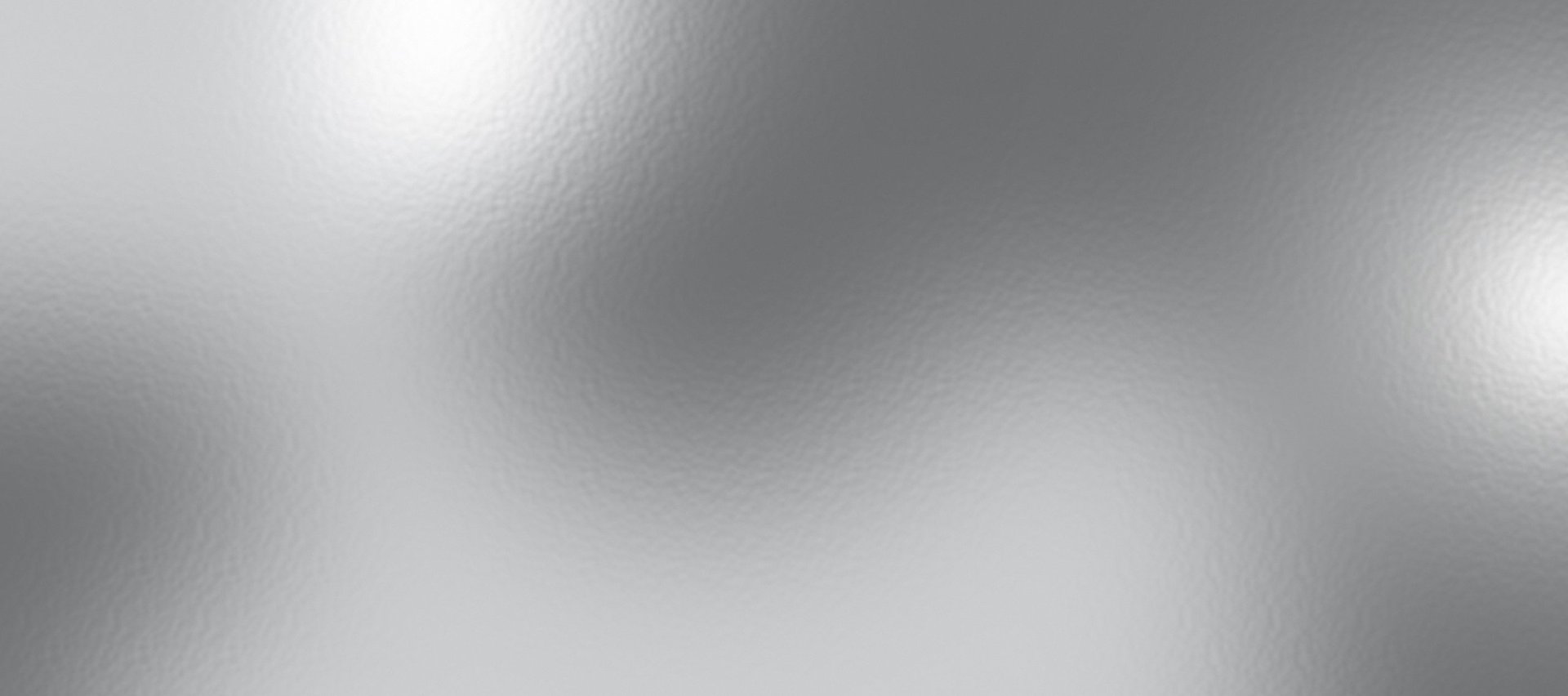 Fine light reflections across a smooth metallic coating surface