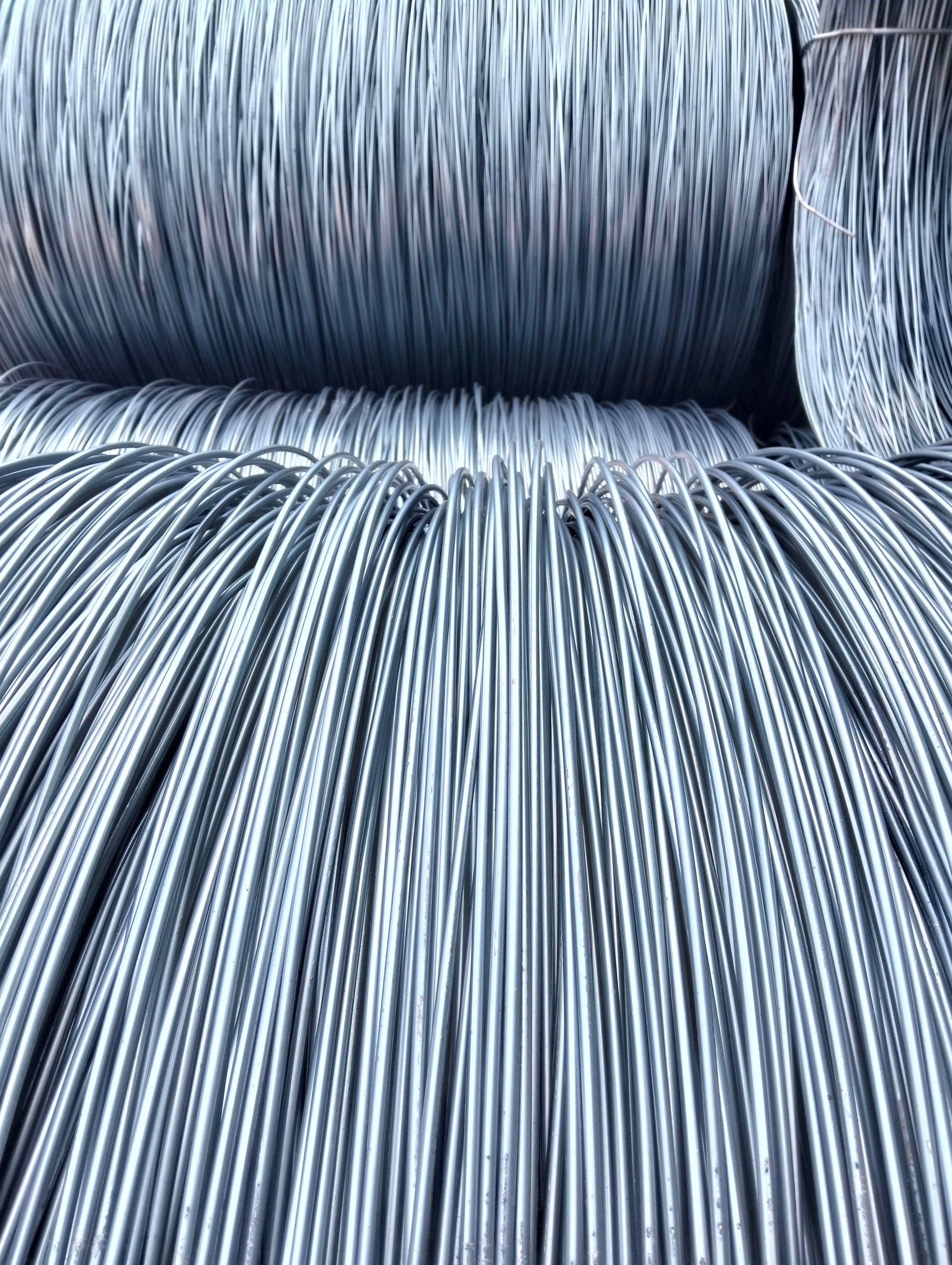 Stacked coils of low-carbon steel wire rod feedstock