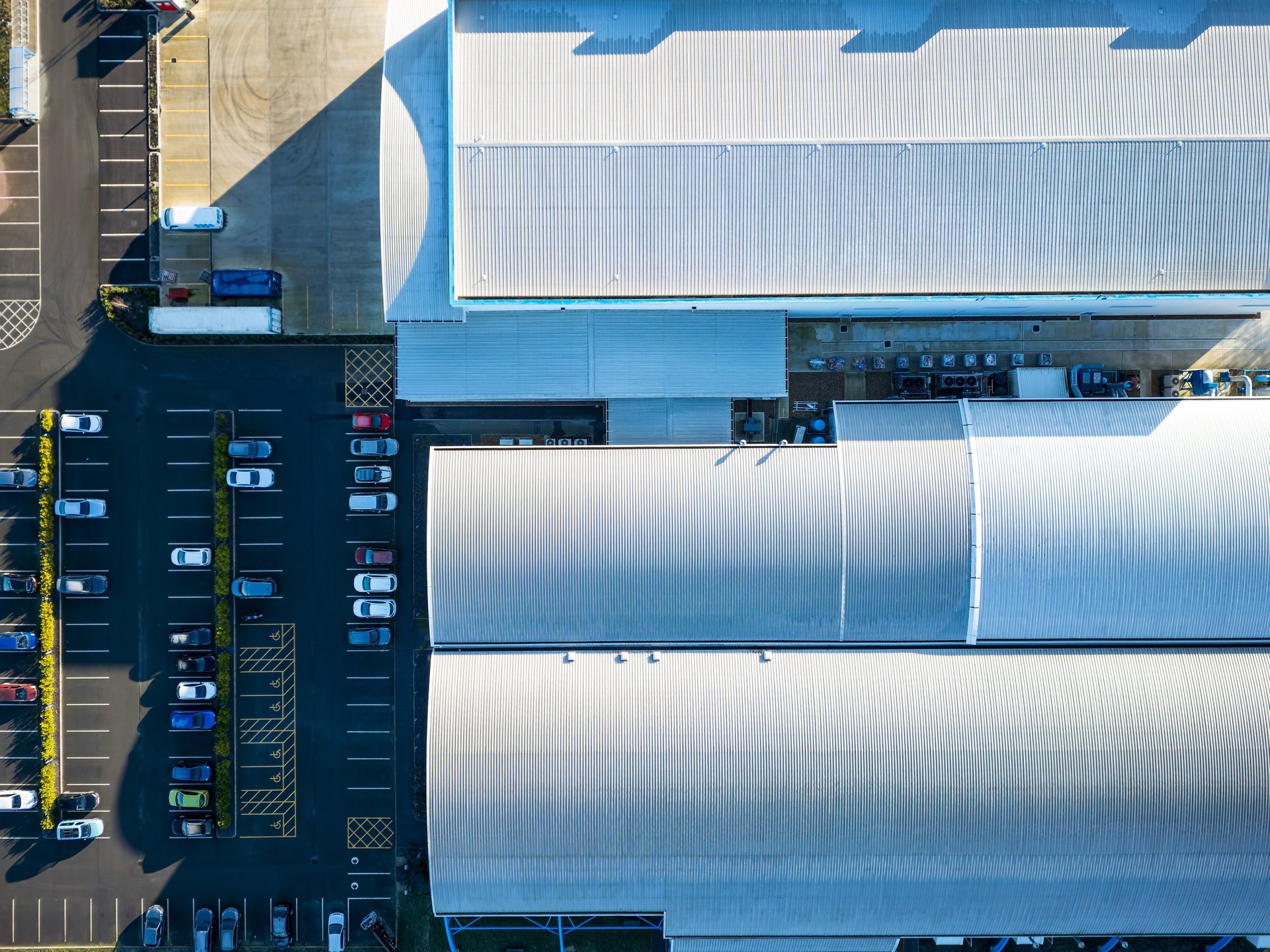 Modern metal-clad factory building seen from above