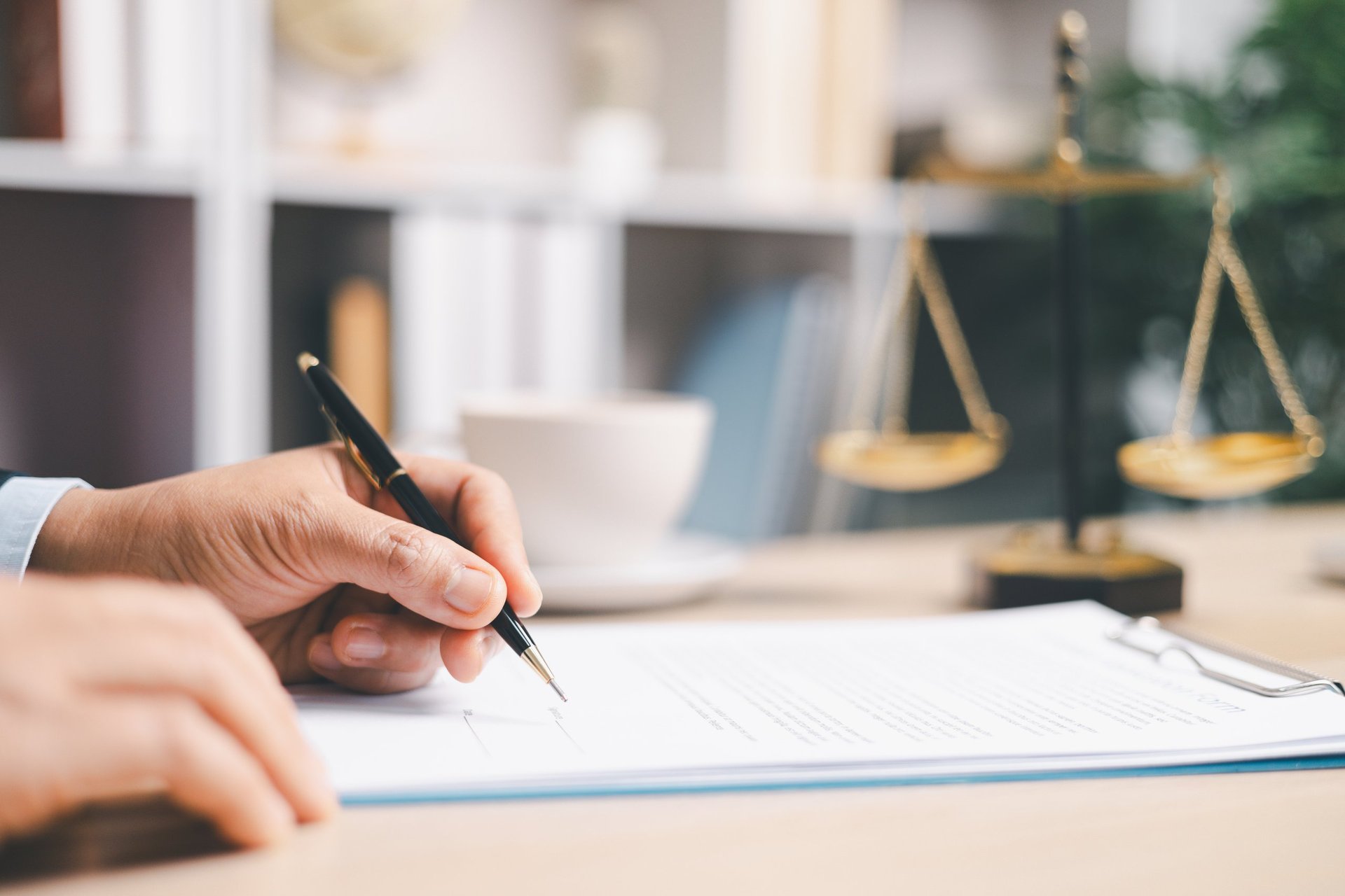 Commercial documentation being reviewed and signed at a desk