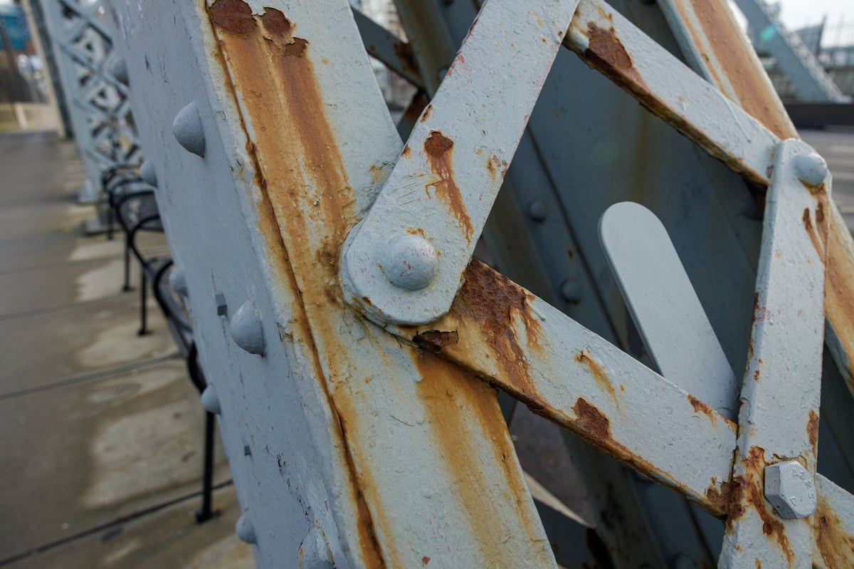 Weathered and corroded steel structure showing surface oxidation on exposed members