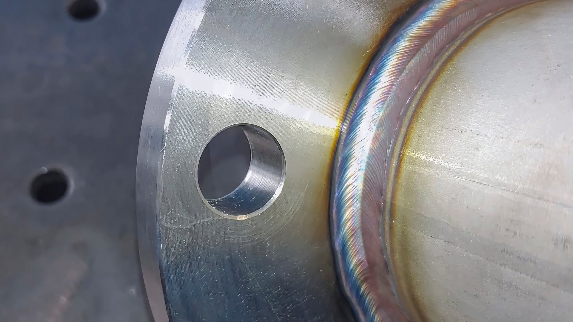 TIG welding process on a large steel pipe stub end, prepared and ready for quality-control testing
