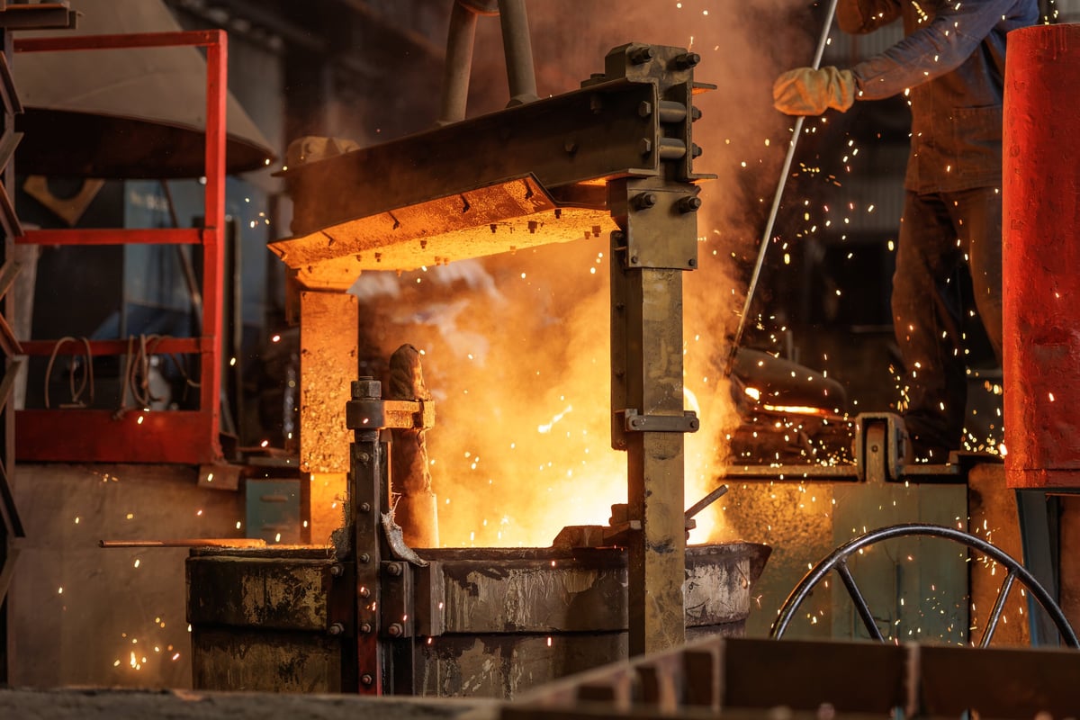 Wire rod coil-forming line with the billet feed route in the foreground.