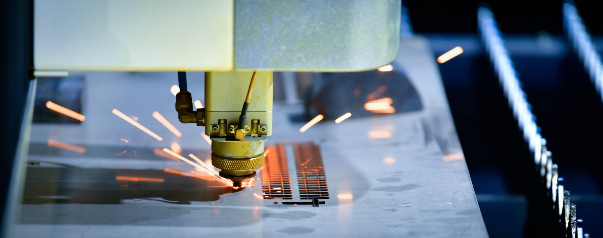 Industrial laser cutting machine processing steel in a metalworking factory