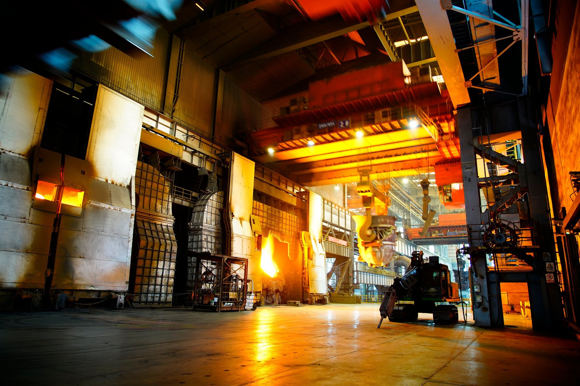 Molten metal pour during an alloying operation in a heavy-industry steel plant