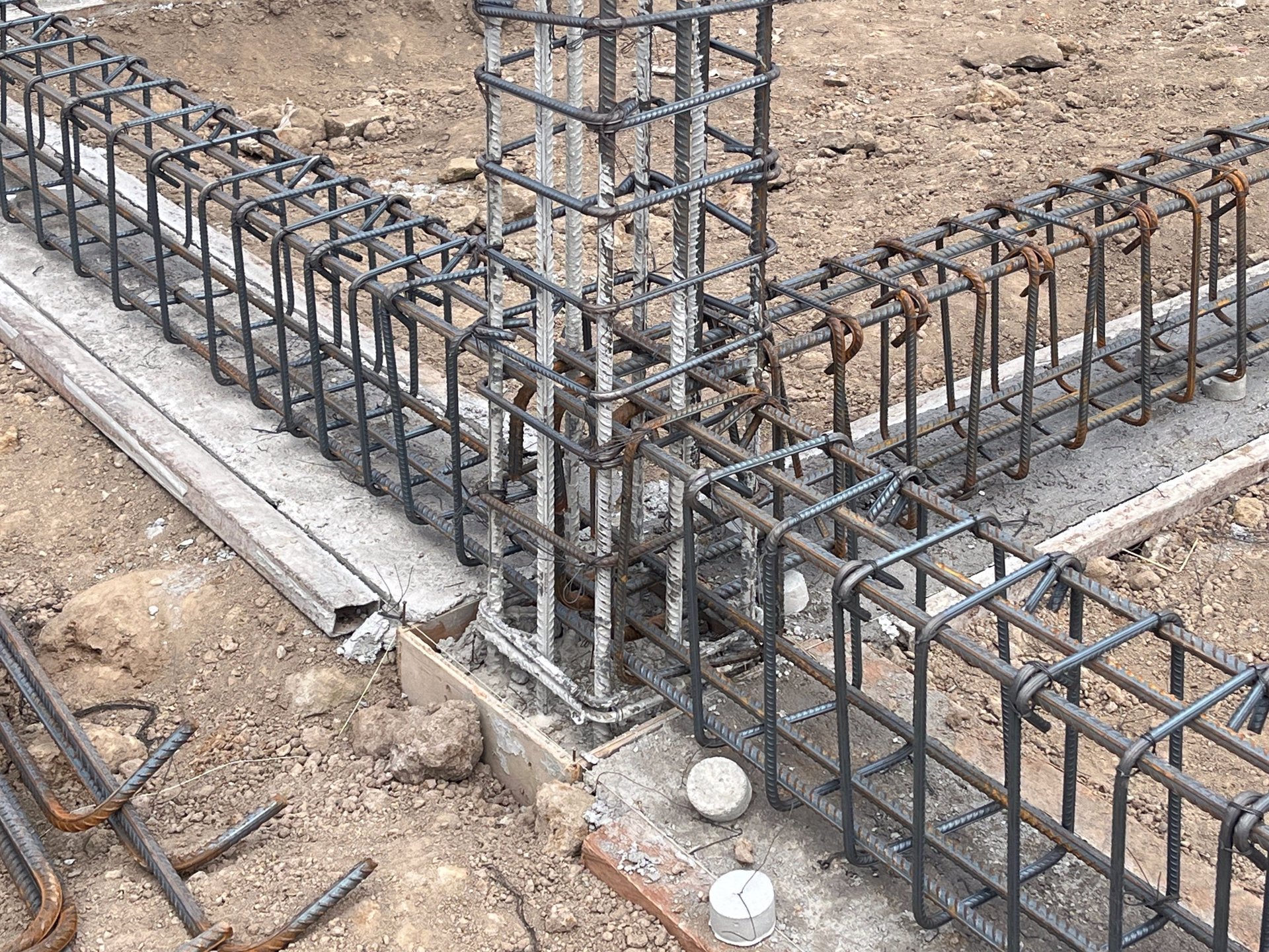 Foundation Rebar — dense steel rebar cages assembled on ground for a concrete foundation, with bar-zone and congestion-review context.