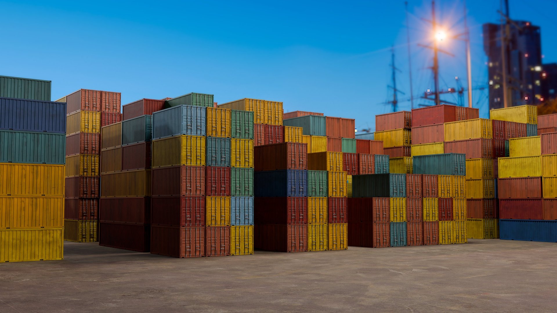 Rows of steel cargo staged for movement at a port, prepared for planned logistics handling across the GCC.