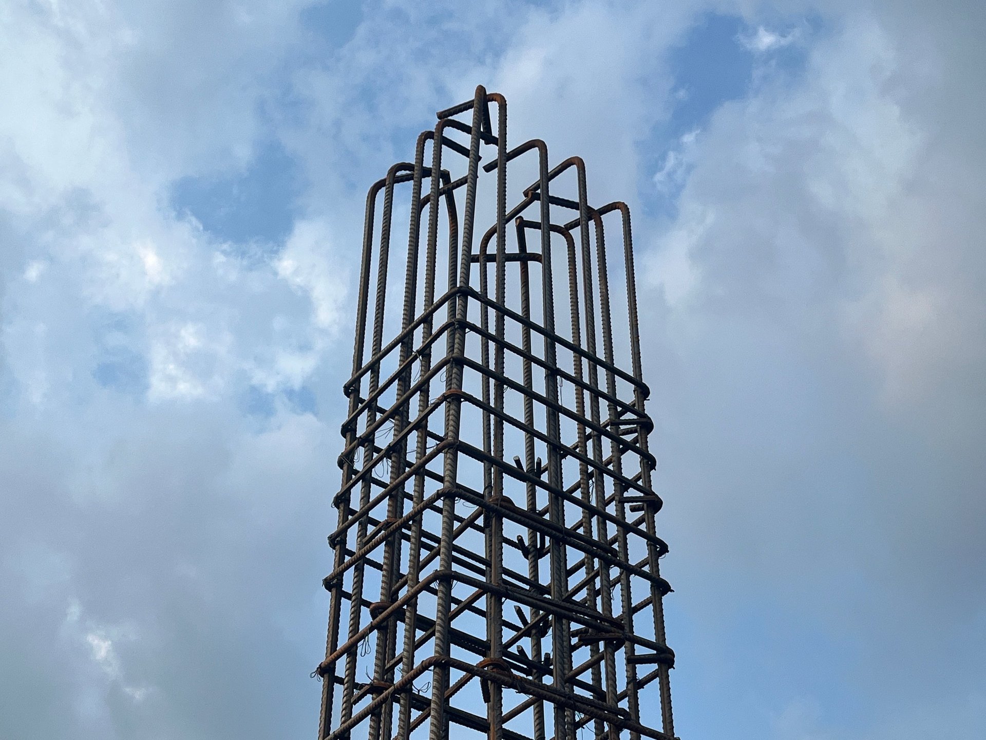 High Rise Building Rebar — high-rise core-wall reinforcement cage with floor-zone tags and vertical splice locations visible in the approved detail.