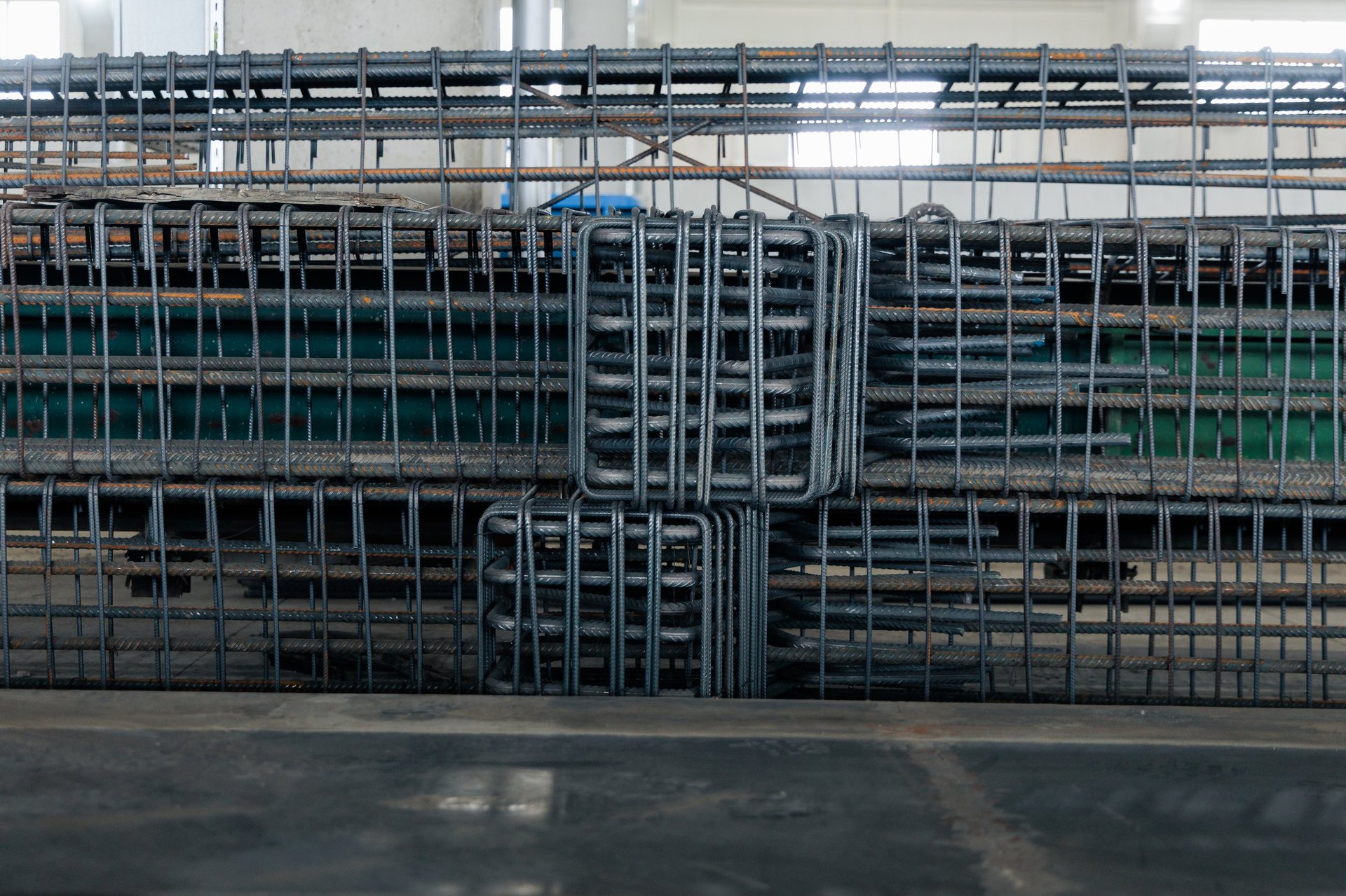 Prepared reinforcement cages staged at a concrete construction site awaiting placement