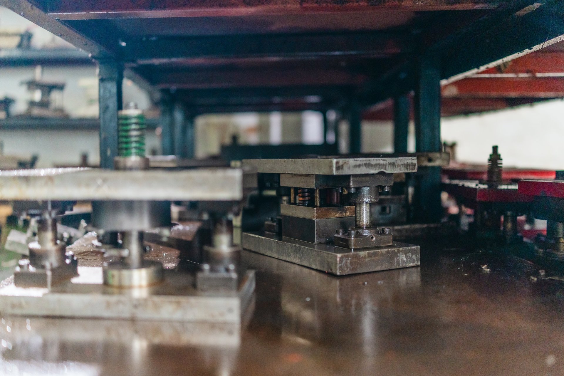 Sheet metal stamping dies and press tool sets organised on storage racks in a toolroom
