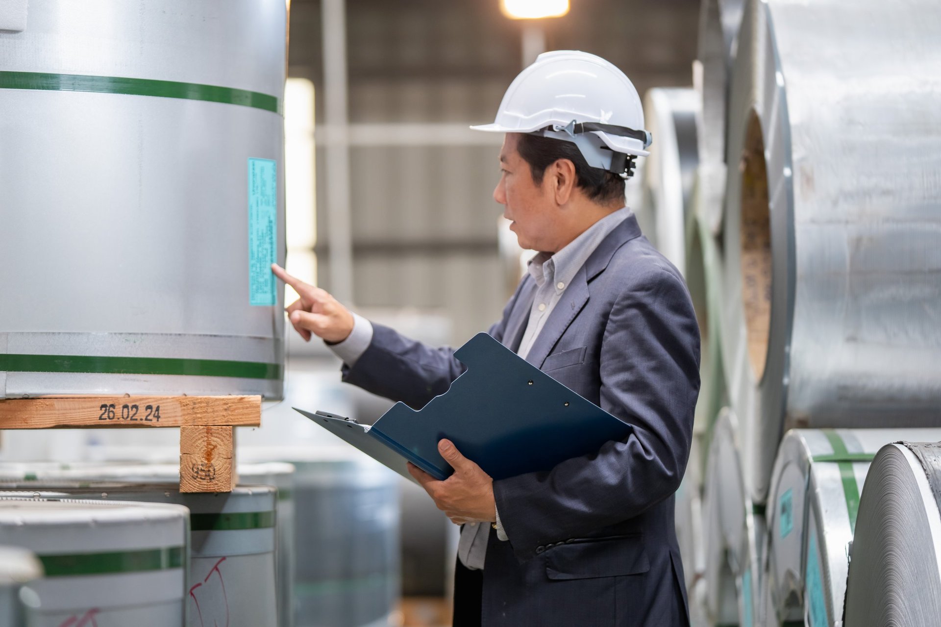 Side-by-side comparison of coated steel sheet surfaces under inspection lighting