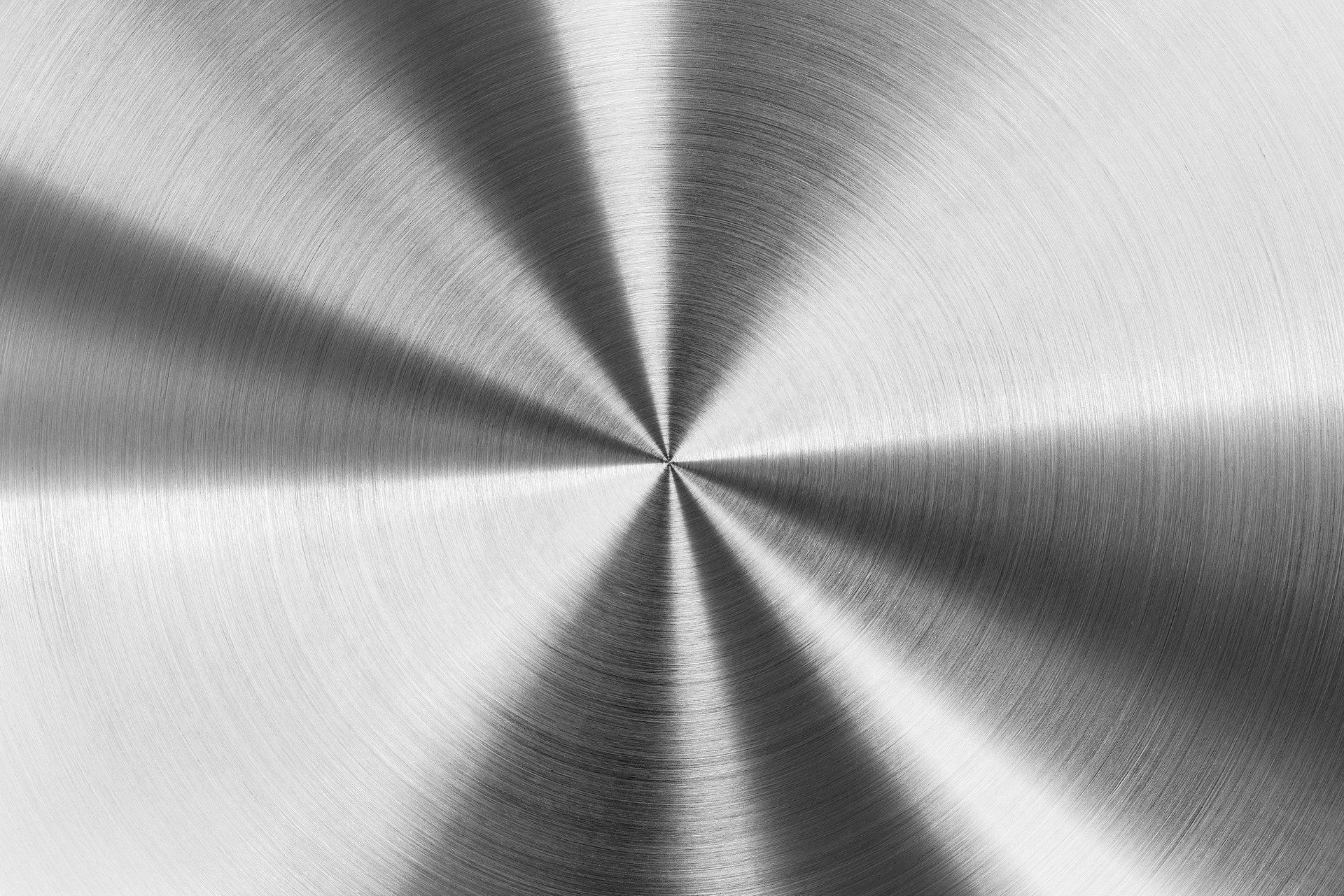Close view of a finely brushed metallic surface with a directional grain