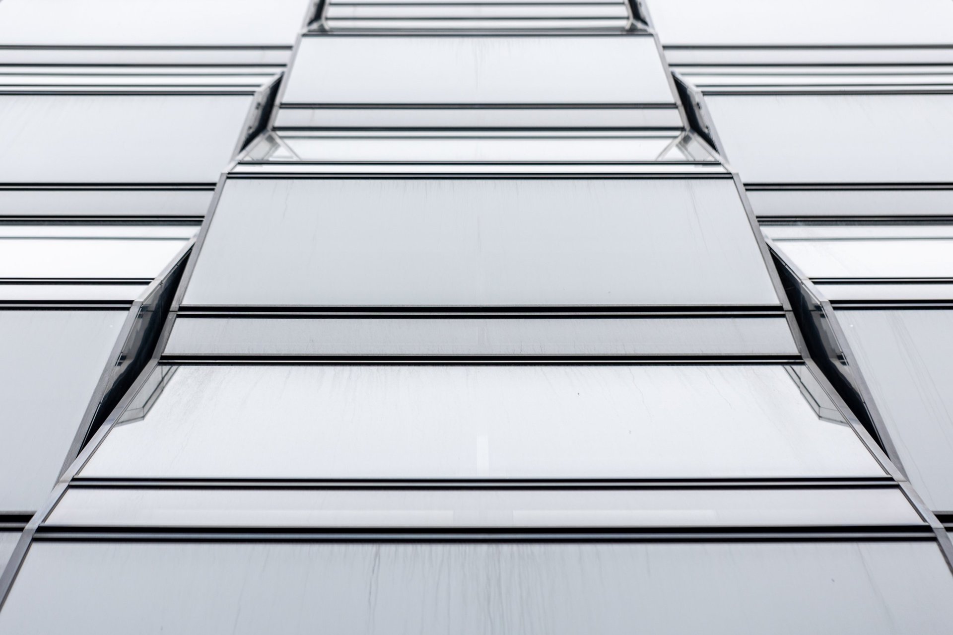 Repeated smooth cladding panels forming a clean geometric facade