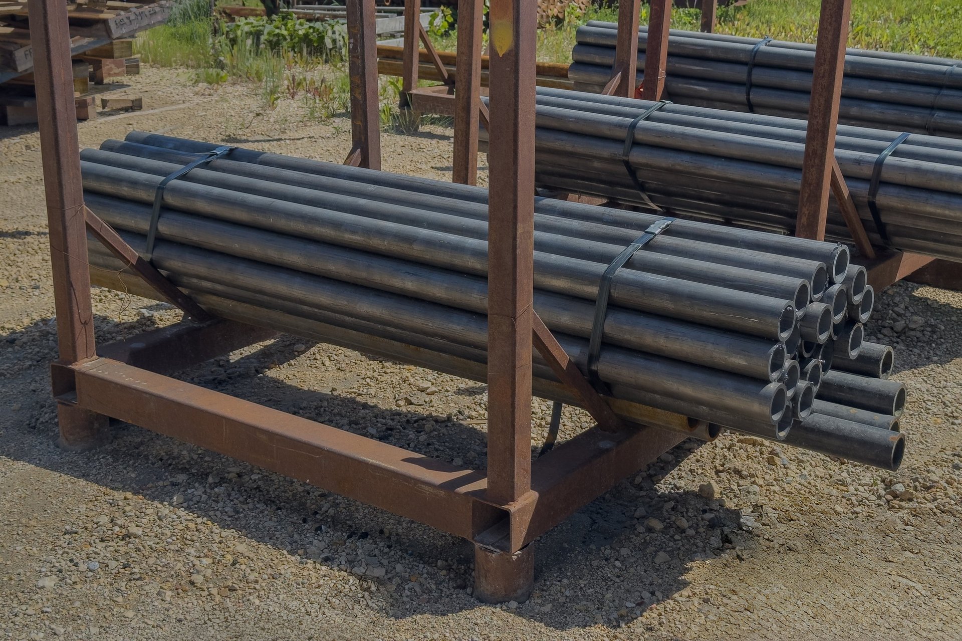 Steel pipe bundled and prepared for a documented logistics handoff at the port