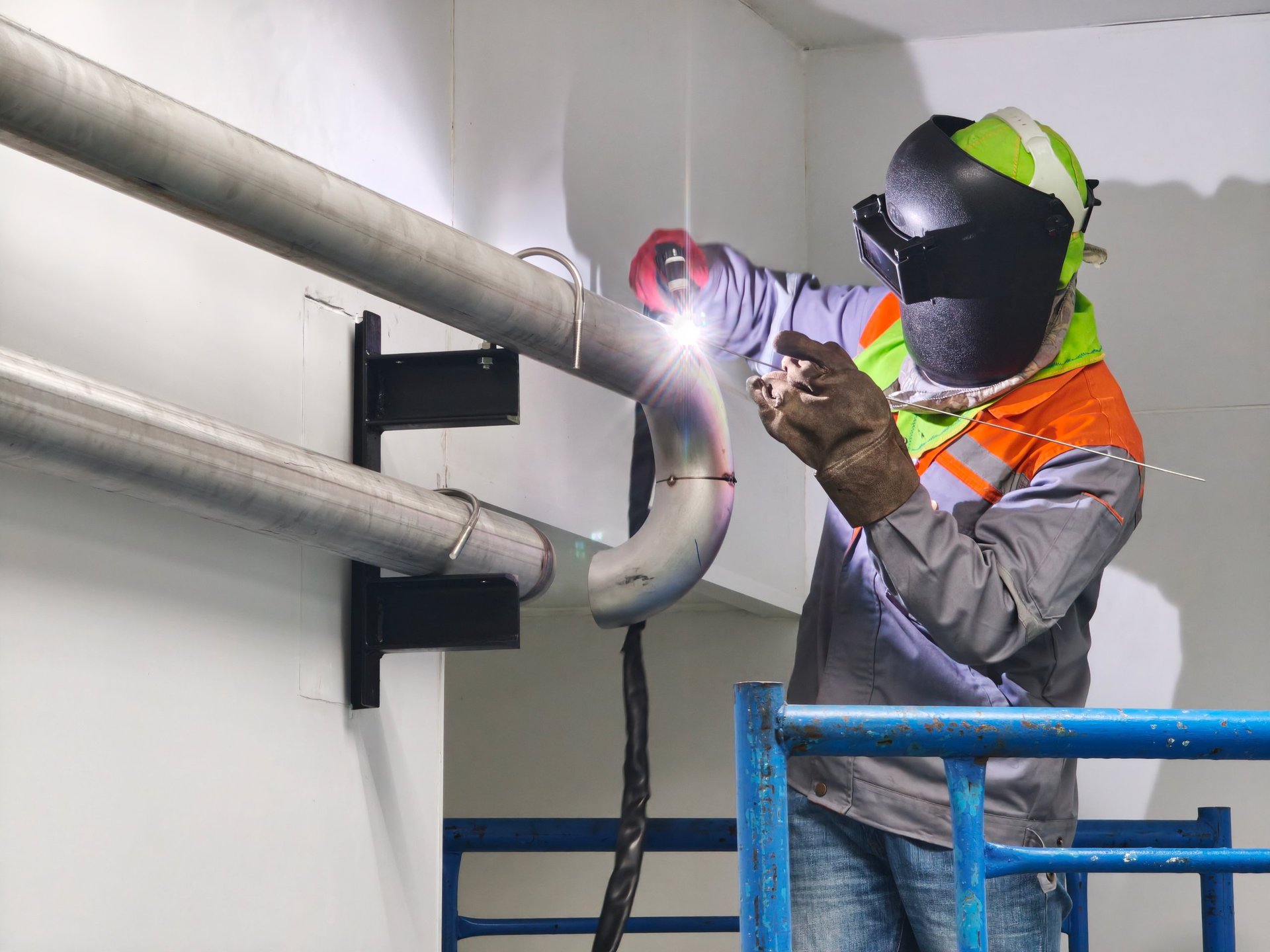 TIG welding an alloy steel pipe joint under controlled conditions