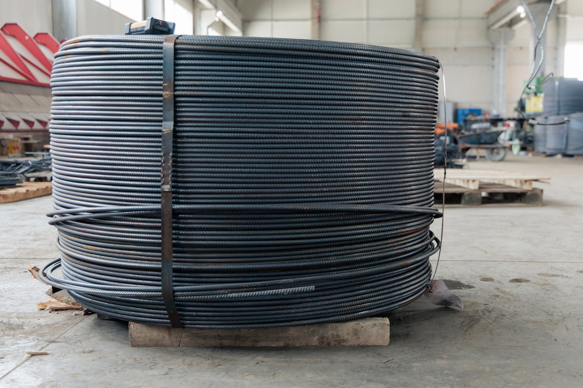 Structural steel sections and coil stock in an industrial yard